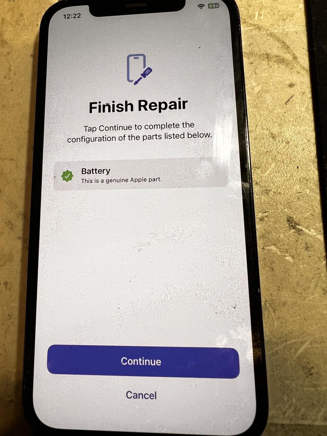 iPhone Settings showing Parts and Service History with green Genuine Apple part checkmark next to Display